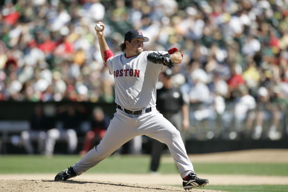 OAKLAND, CA - AUGUST 30:  Mike Burns of the Boston Red Sox pitches against the Oakland Athletics at McAfee Coliseum in Oakland, California on August 30, 2006.  (Photo by Michael Zagaris/MLB Photos via Getty Images)
